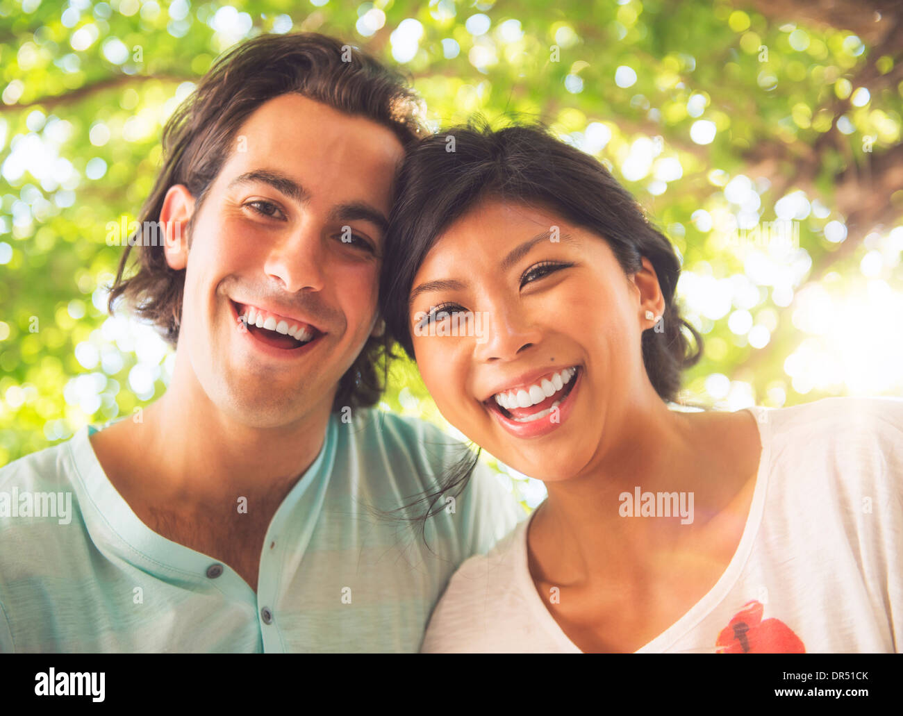 Couple smiling outdoors Stock Photo - Alamy