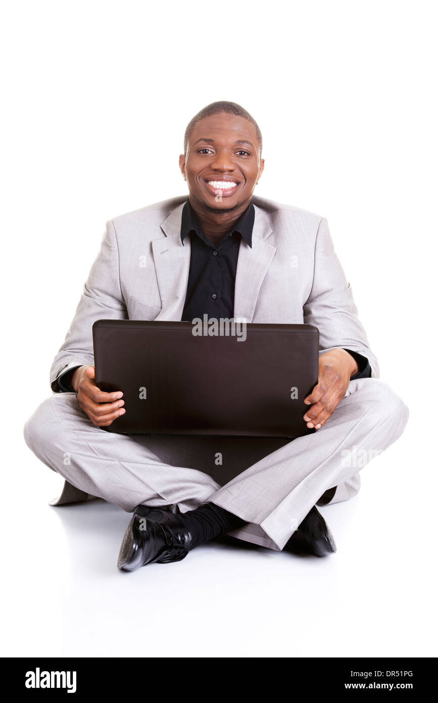 Successful businessman working on laptop, isolated on white Stock Photo