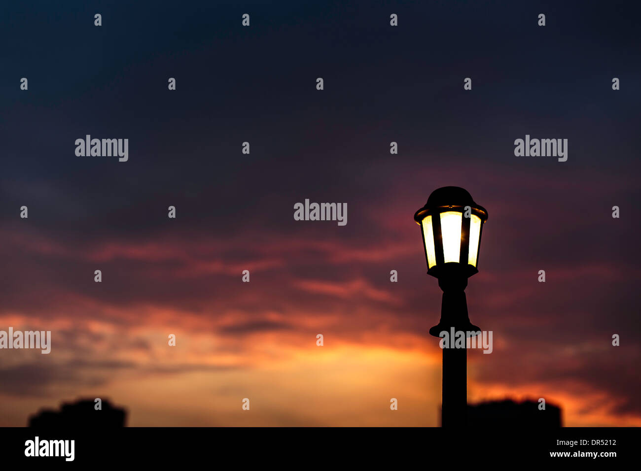 orange blue sky sunset lamp light evening beam iron clouds Egypt Stock