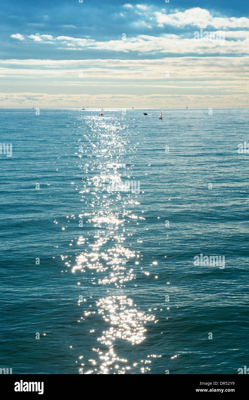 beautiful sea landscape with boats and sun glare Stock Photo