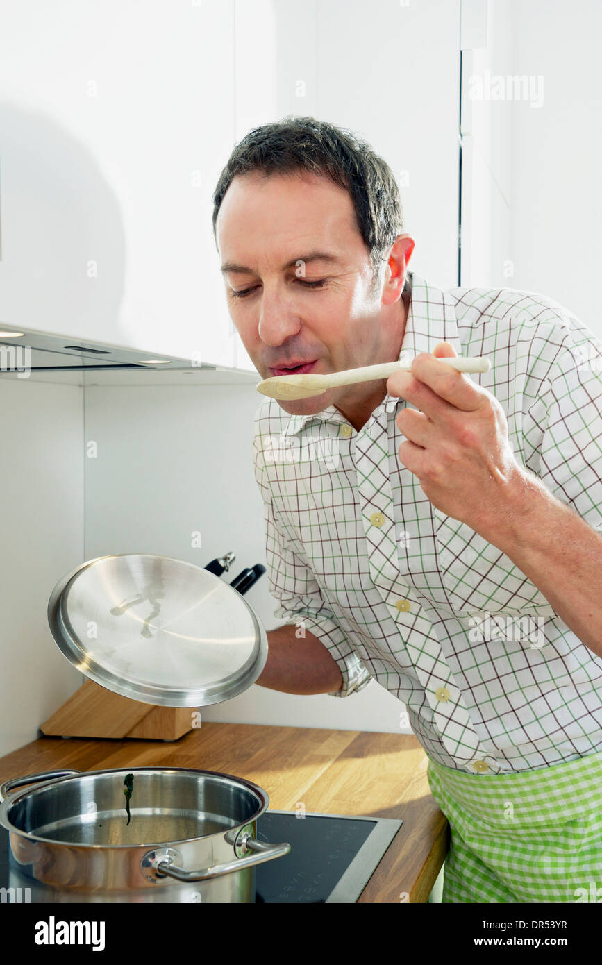 Man Holding Spoon, Eyes Closed Stock Photo - Alamy