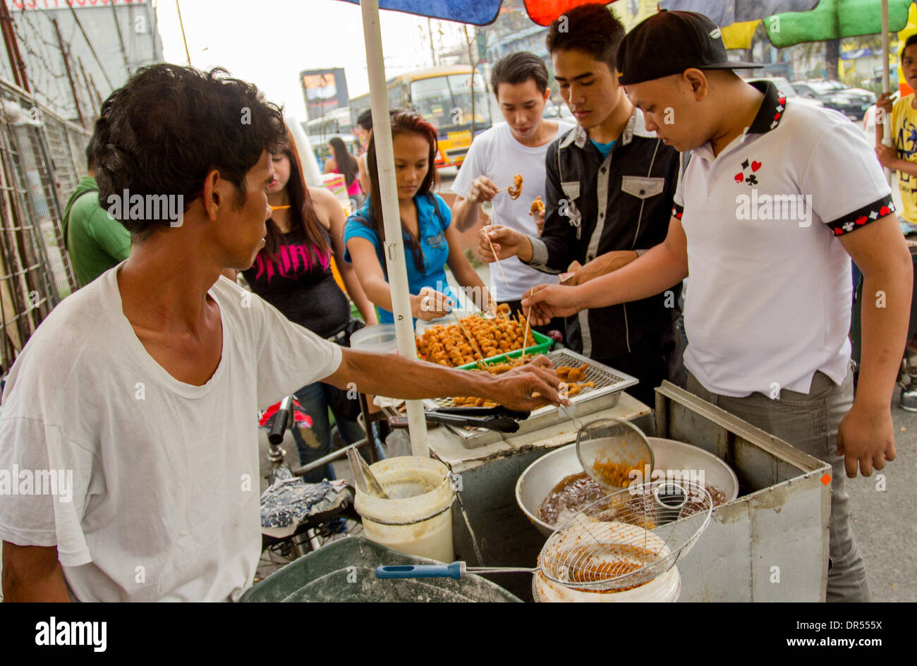 Pasay City, PhilippinesJanuary 20, 2014 Street vendor selling his