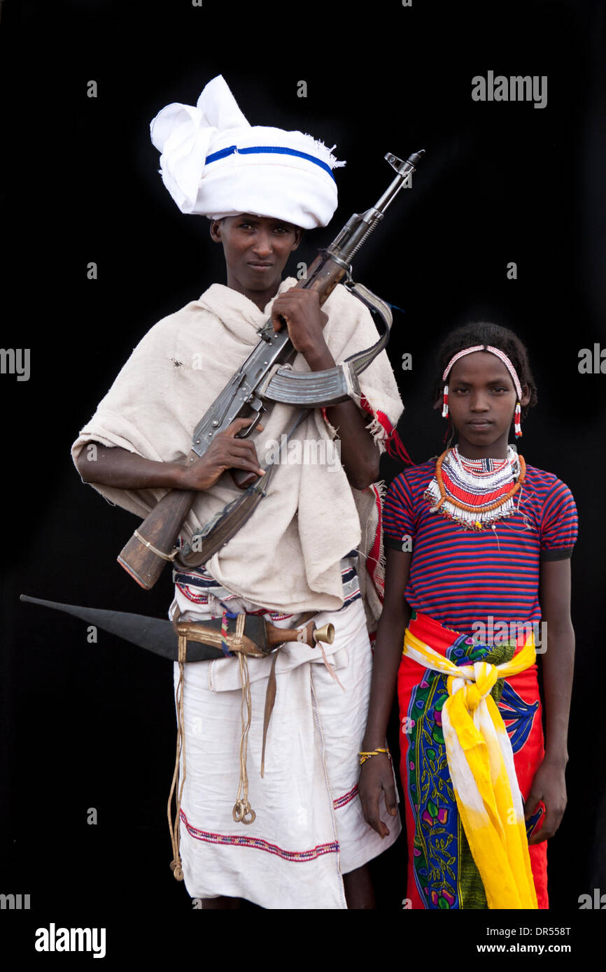 armed young man with his bride in Awash, Harar, Ethiopia Stock Photo