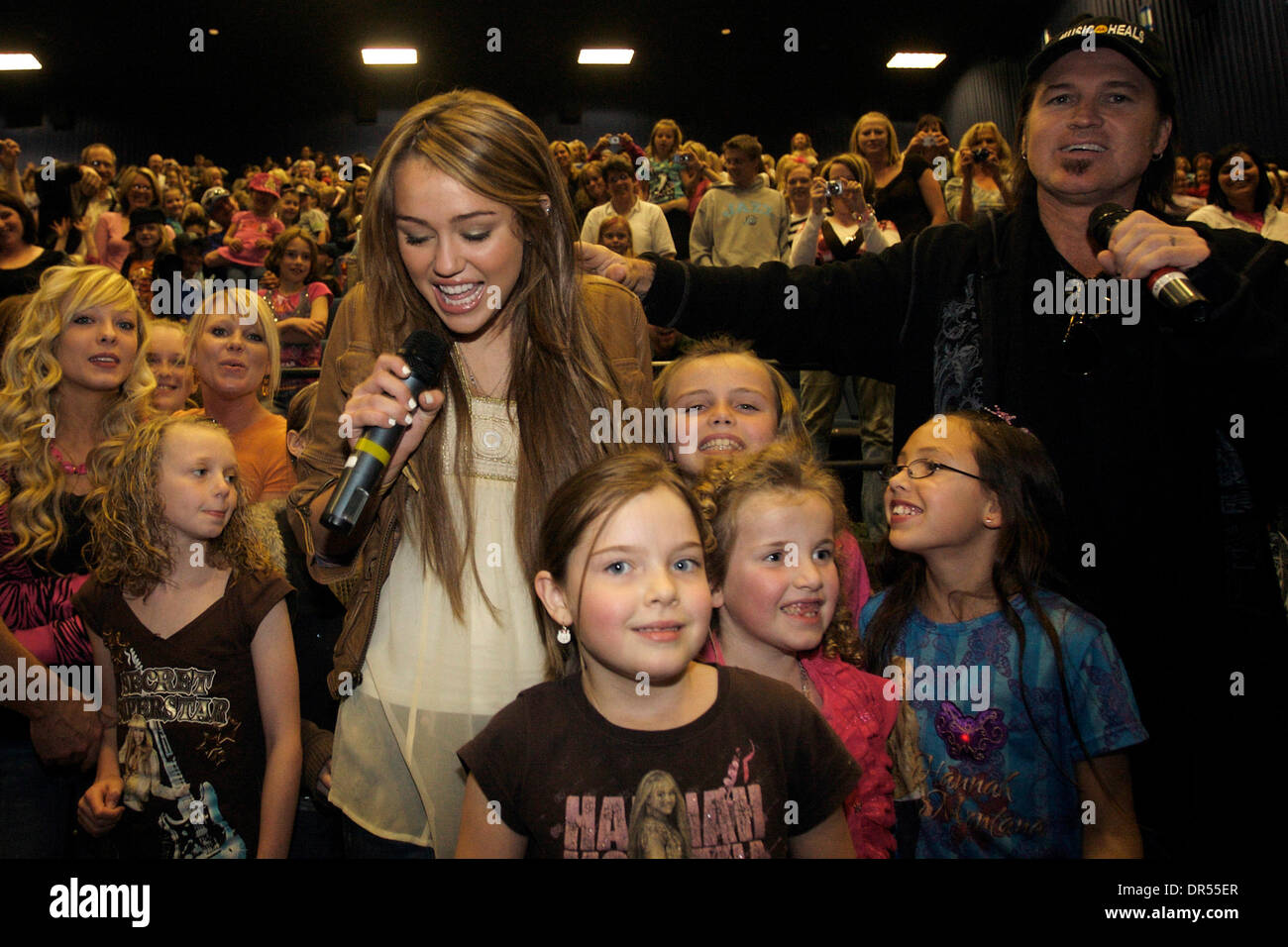 Apr 10, 2009 - Salt Lake City, Utah, USA - MILEY CYRUS and BILLY RAY CYRUS greet fans before the opening of the 'Hannah Montana' movie at the Megaplex 20 at The District. Miley's visit is part of a program by Walt Disney Pictures called 'Opening Weekend Surprise,' where different stars and movie talent visit unsuspecting theater audiences during the opening weekend of a show. Utah  Stock Photo