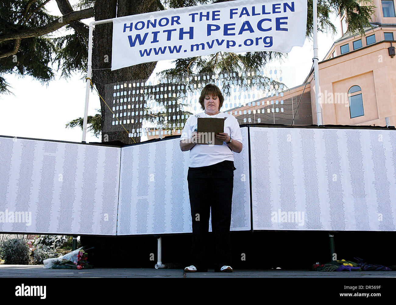 Mar 02, 2009 - Mountain View , California, USA - The Obama administration has lifted the ban on news coverage of flag draped caskets returning home at Dover Air Force base, according to CBS news.           PICTURED: Mar 18, 2007 - Mountain View , California, USA - KAREN MEREDITH reads names at the temporary Peace Memorial at Mountain View Civic Center Plaza marking the fourth anniv Stock Photo