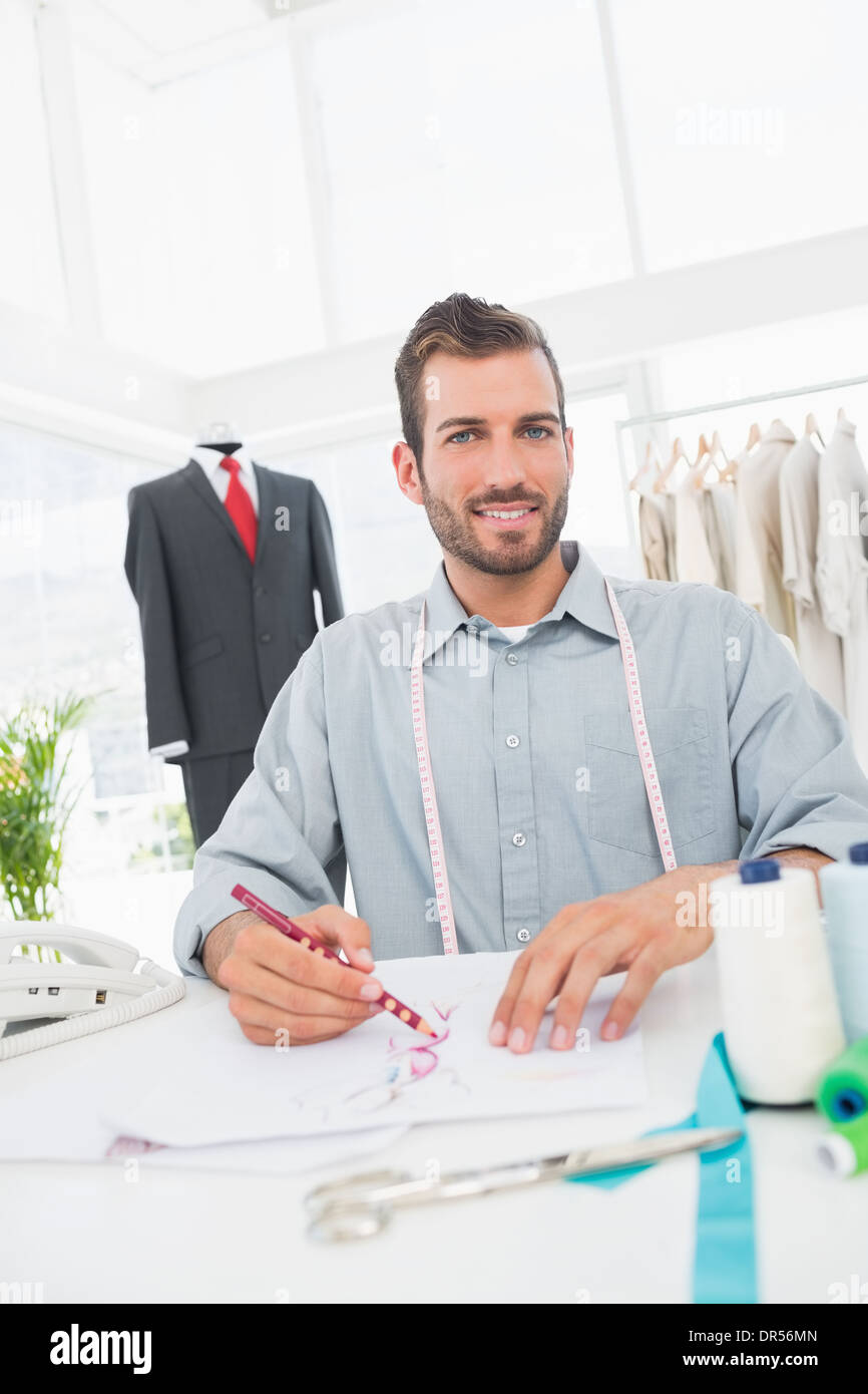 Fashion designer working on his designs in studio Stock Photo