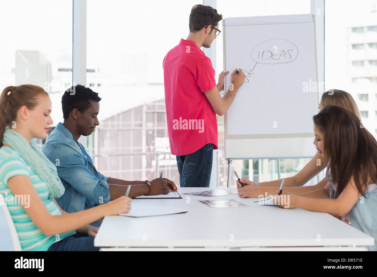Casual Business People In Office At Presentation Stock Photo