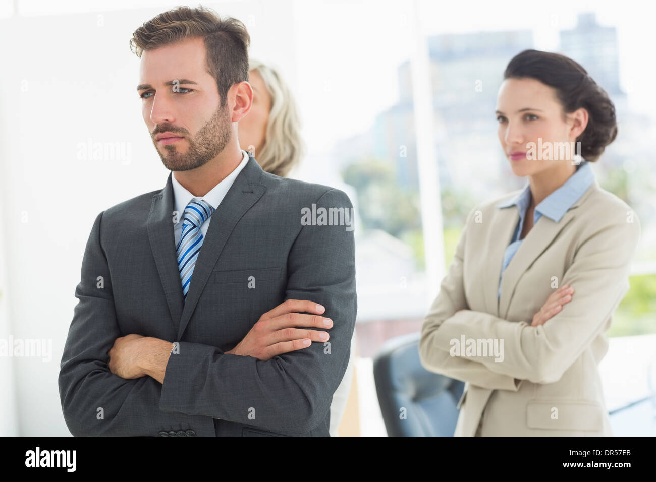 Confident and serious business team with arms crossed Stock Photo - Alamy