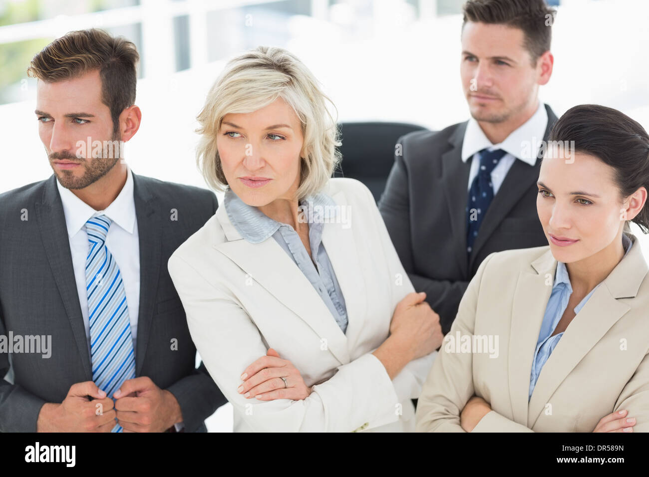 Confident and serious business team in office Stock Photo - Alamy