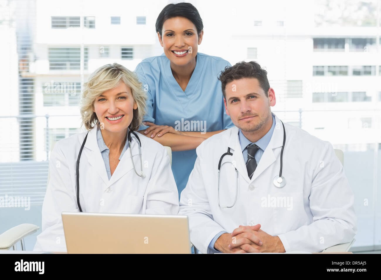 Doctors with laptop at the medical office Stock Photo Alamy