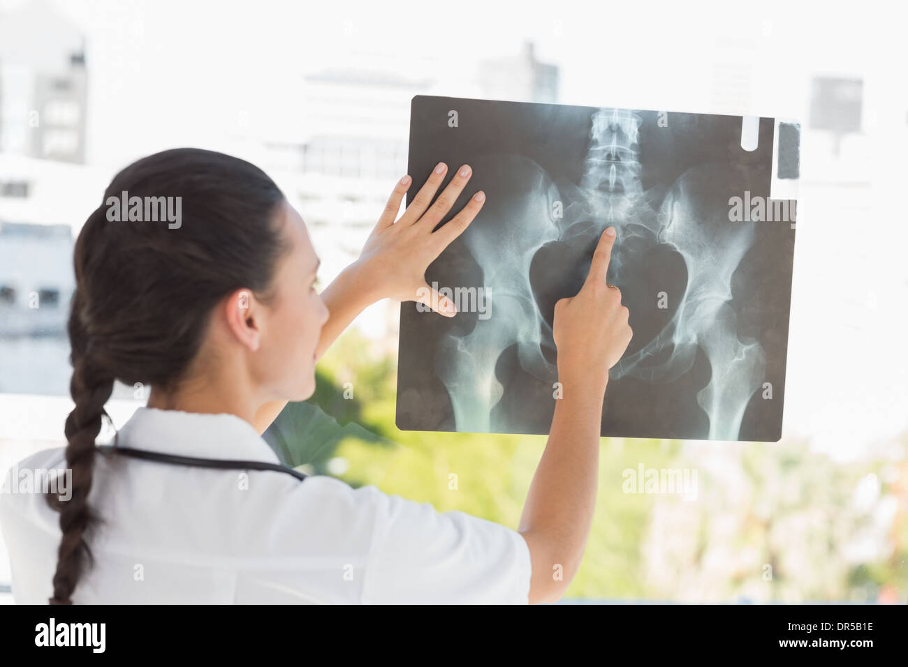 Female physician pointing ray hi-res stock photography and images - Alamy