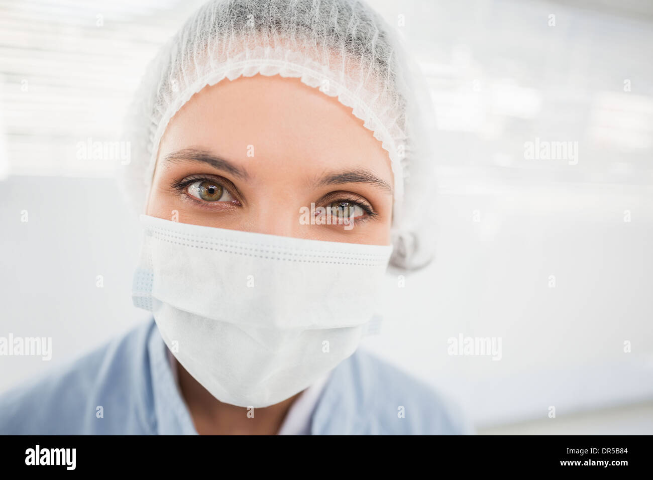 Female surgeon wearing surgical cap and mask Stock Photo - Alamy