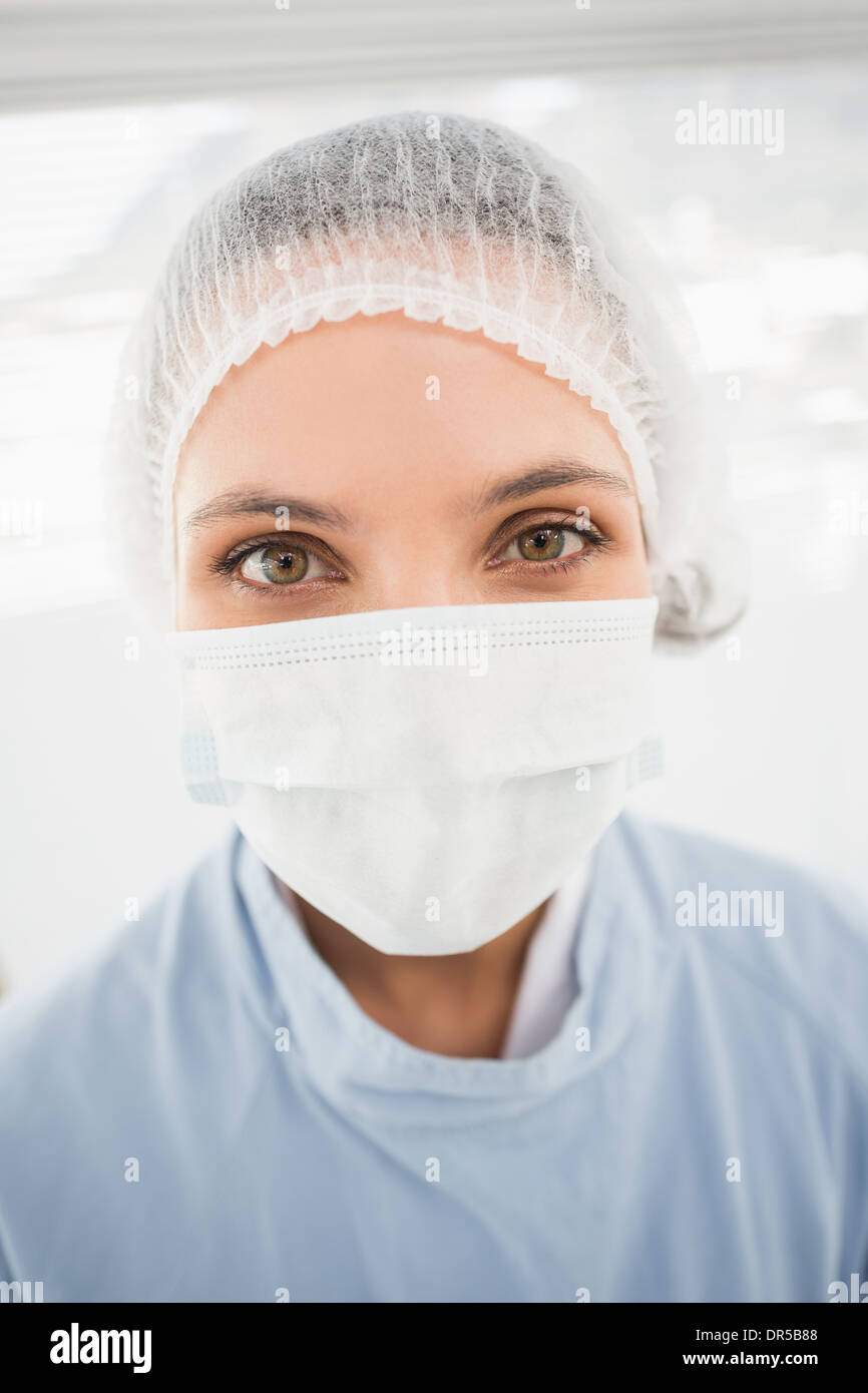 Female surgeon wearing surgical cap and mask Stock Photo - Alamy