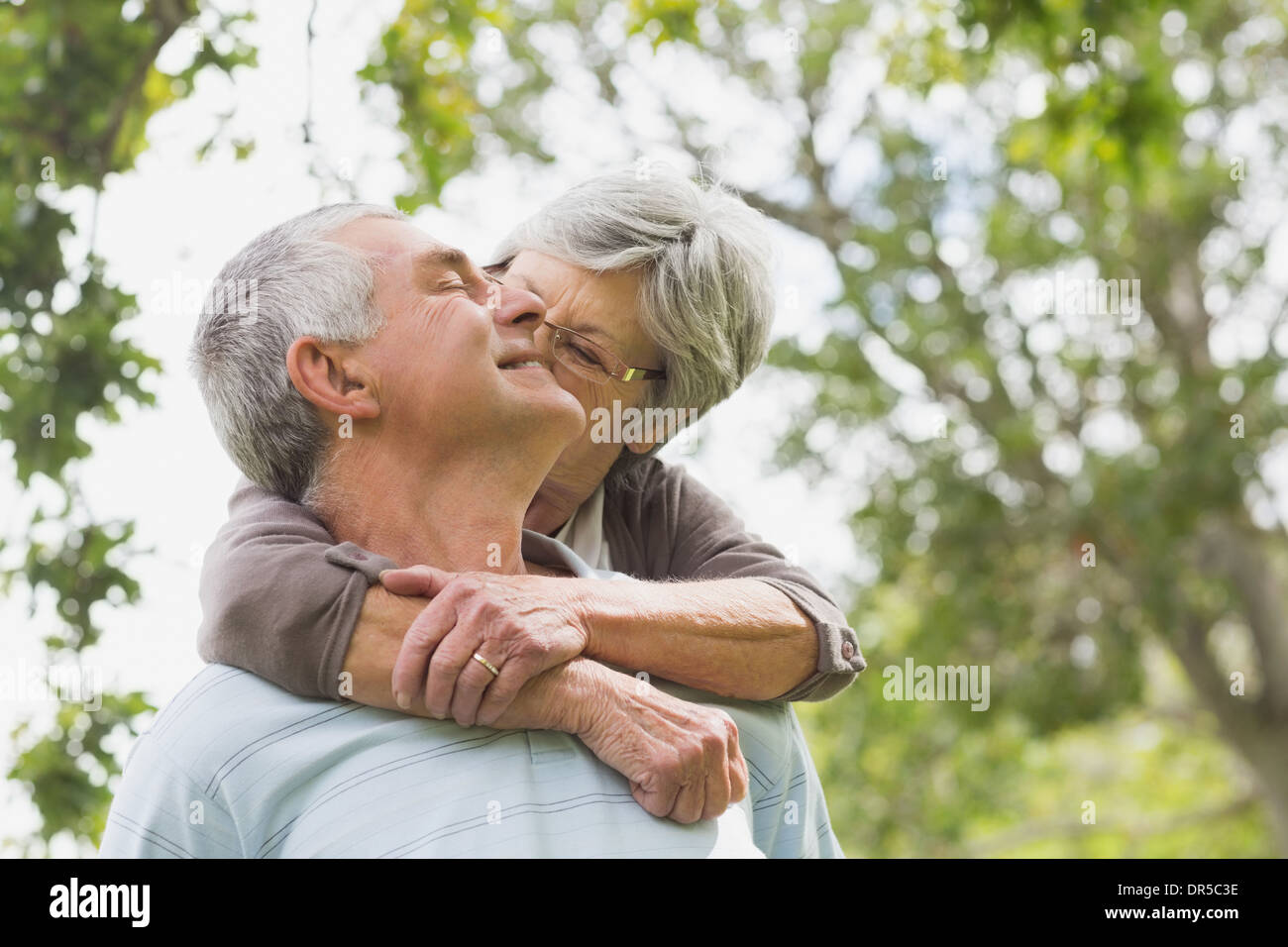 Man arm around woman behind hi-res stock photography and images - Alamy