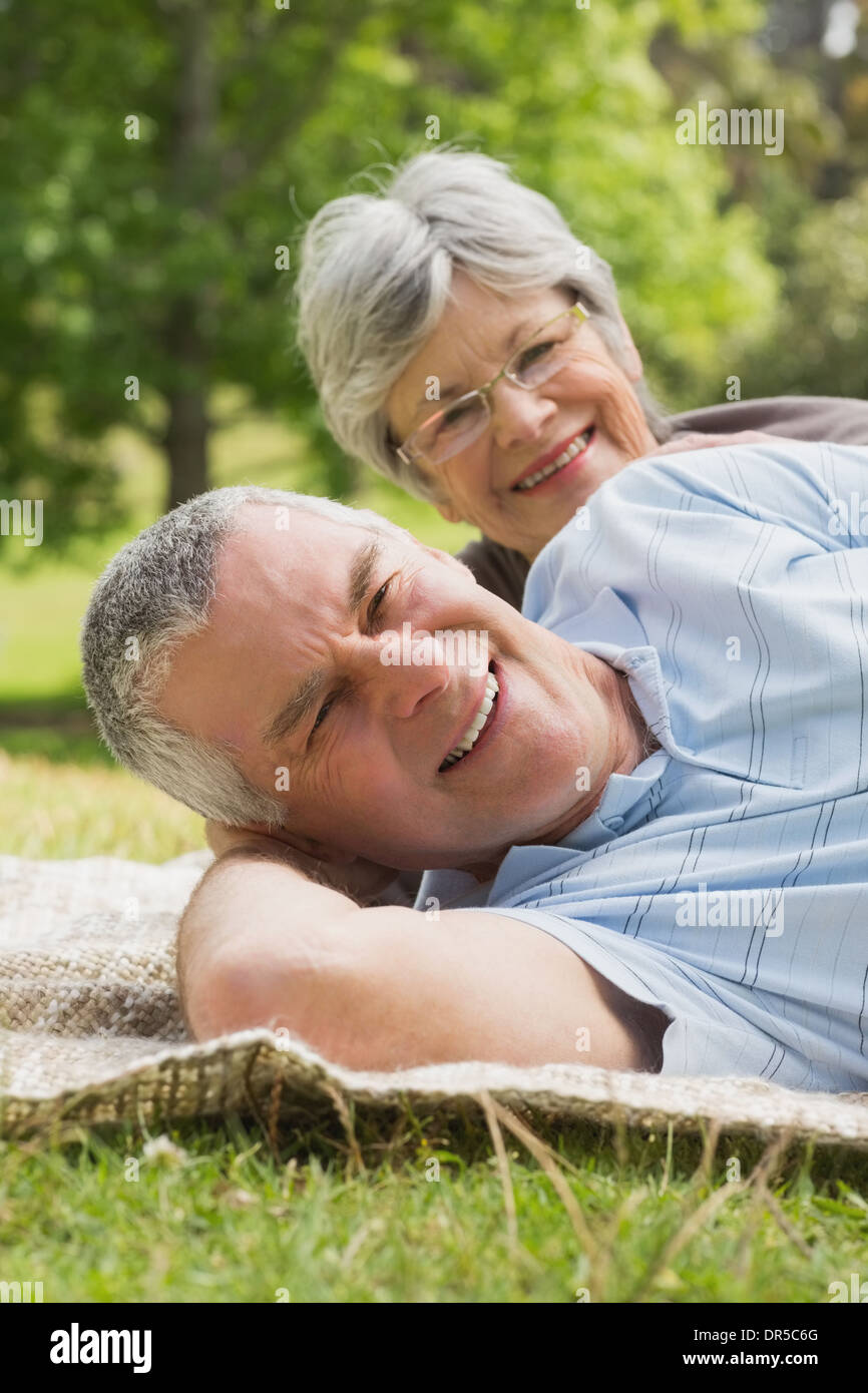 Mature couple lying grass hi-res stock photography and images - Alamy