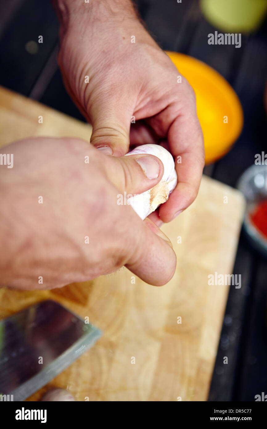 Person peeling garlic hi-res stock photography and images - Alamy