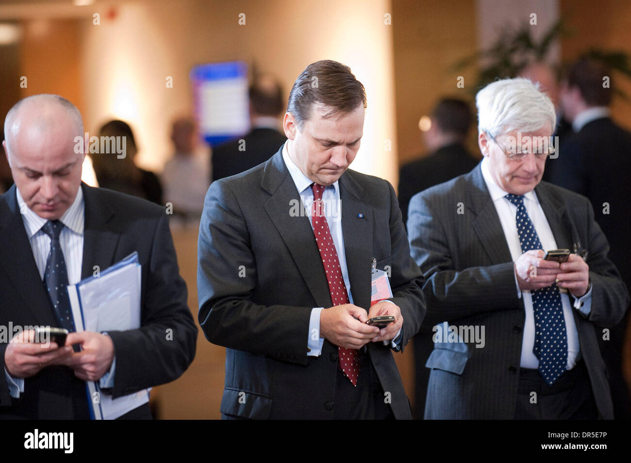 Mar 05, 2009 - Brussels, Belgium - Polish Foreign Minister RADEK SIKORSKI (L) texts on his cell phone during a NATO Foreign ministers meeting in Brussels, Belgium on 2009-03-05. NATO Secretary General Jaap de Hoop Scheffer called for the alliance to resume top-level talks with Russia which have been frozen since last August's war in Georgia. (Credit Image: © Wiktor Dabkowski/ZUMA P Stock Photo