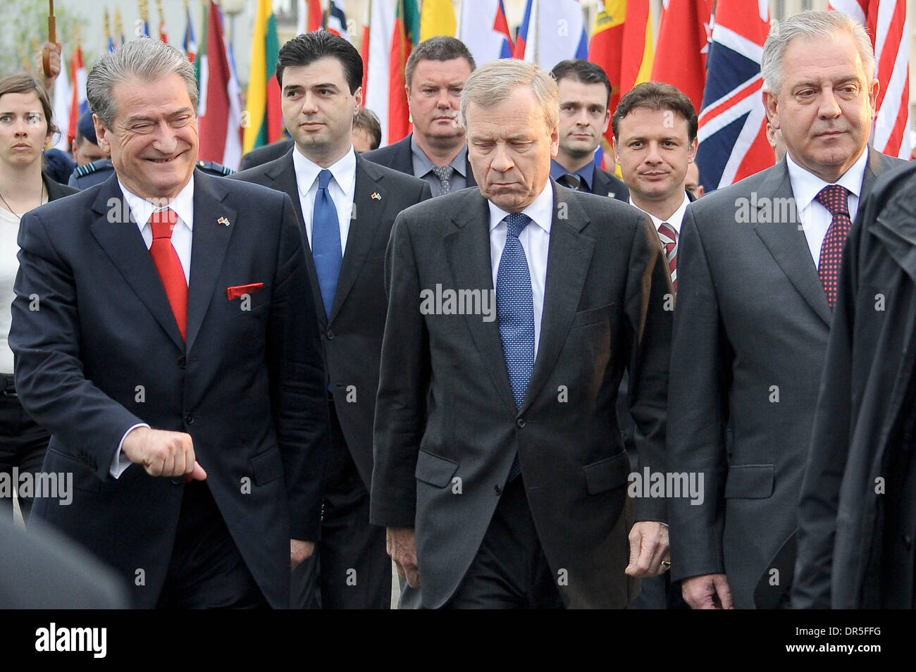 NATO Secretary-General Jaap de Hoop Scheffer (C), Albanian Prime Minister Sali Berisha (L) and his Foreign Minister Lulzim Basha (L in the background), Croatia Prime Minister Ivo Sanader (R) and his Foreign Minister Gordan Jandrokovic (R in the background) arrive to attend a ceremony to mark the accession of Albania and Croatia at the NATO Headquarters   in  Brussels, Belgium on 20 Stock Photo