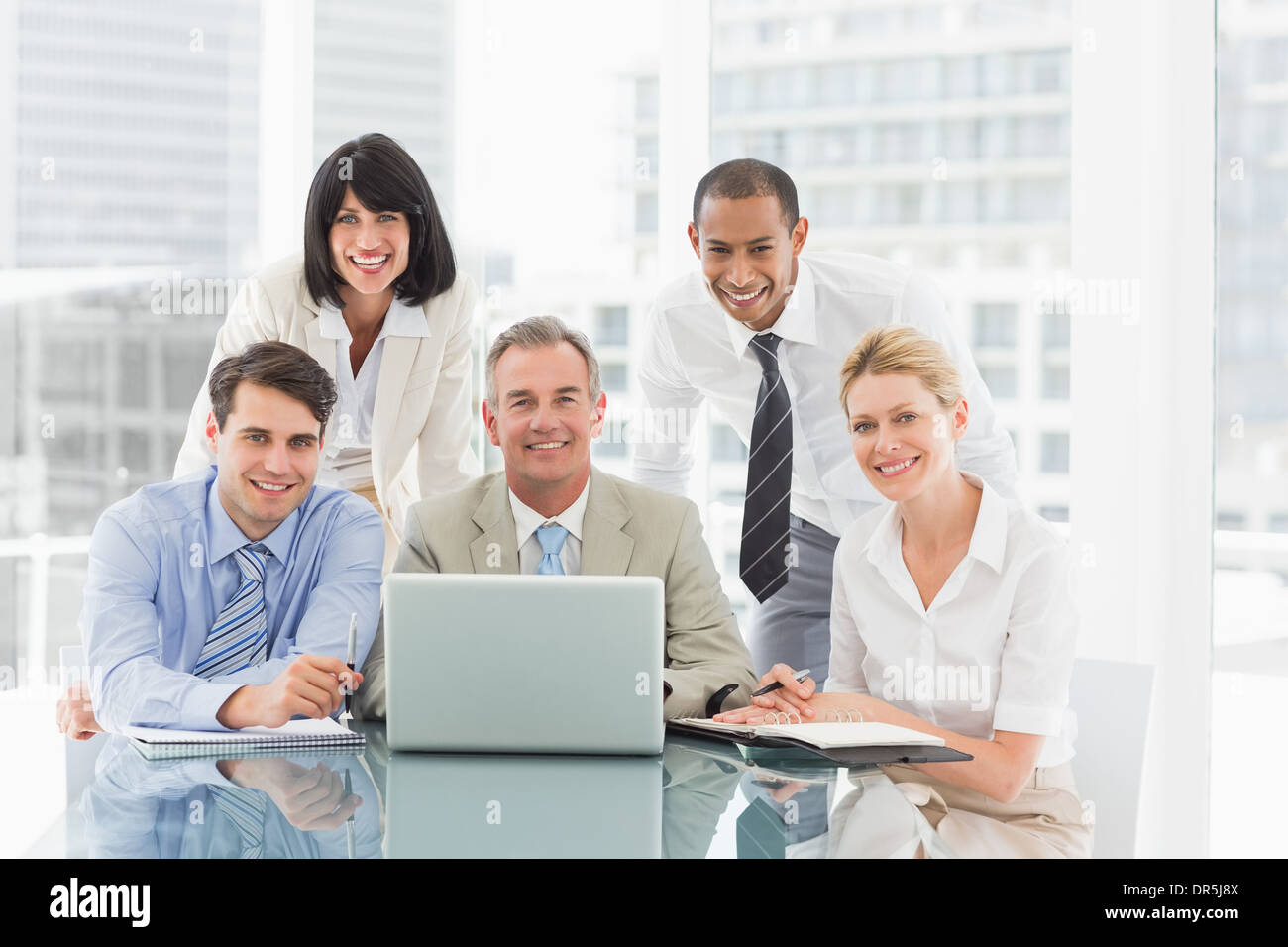 Business People Gathered Around Laptop High Resolution Stock ...