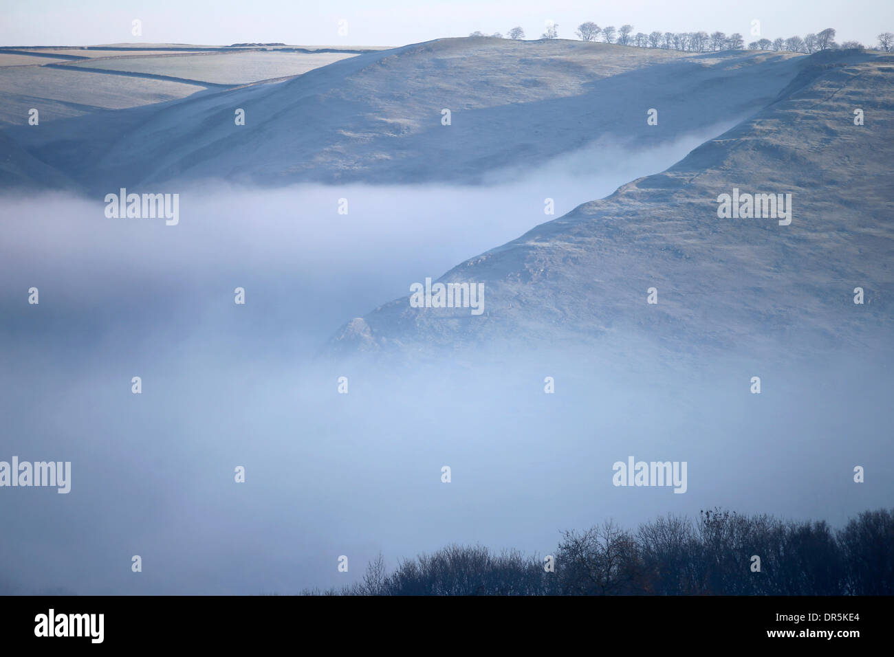 Ashbourne, Peak Districk, UK . 20th Jan, 2014. Freezing mist clings to the steep slopes surrounding Dovedale near Ashbourne in The Derbyshire Peak District today. Credit:  Joanne Roberts/Alamy Live News Stock Photo