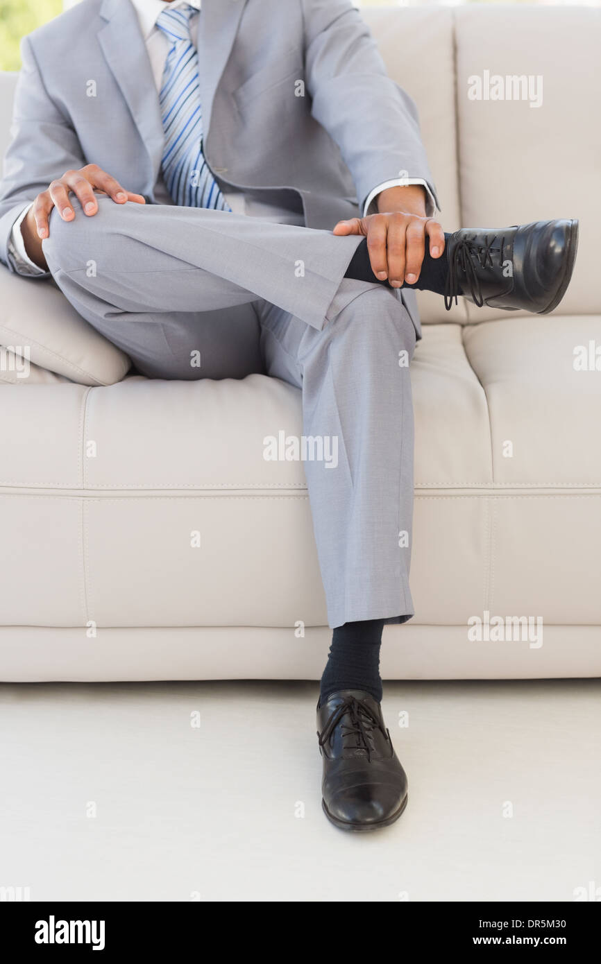 Businessman on couch Stock Photo
