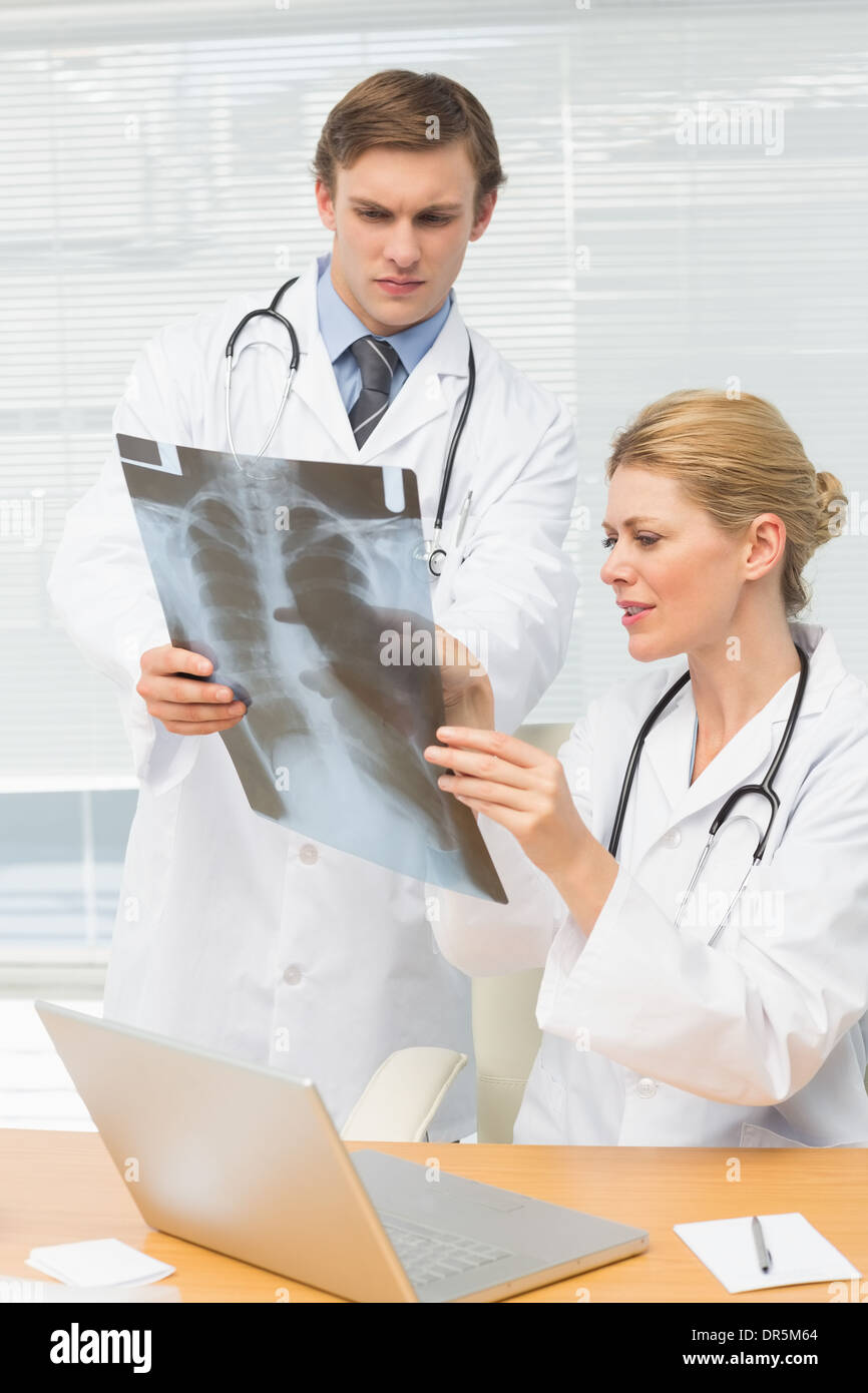 Doctors examining an xray together Stock Photo - Alamy