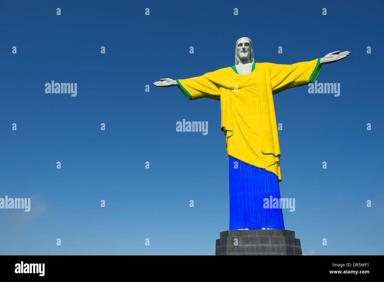 Christ the Redeemer wearing Brazil colors football soccer uniform at Corcovado Rio de Janeiro Stock Photo
