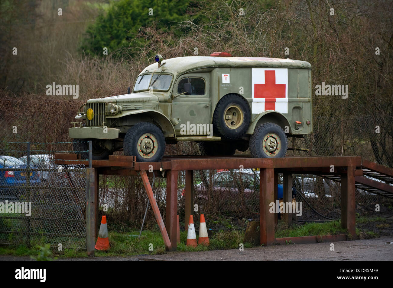 Old US Army ambulance on ramp outside garage at Peterchurch Herefordshire England UK Stock Photo