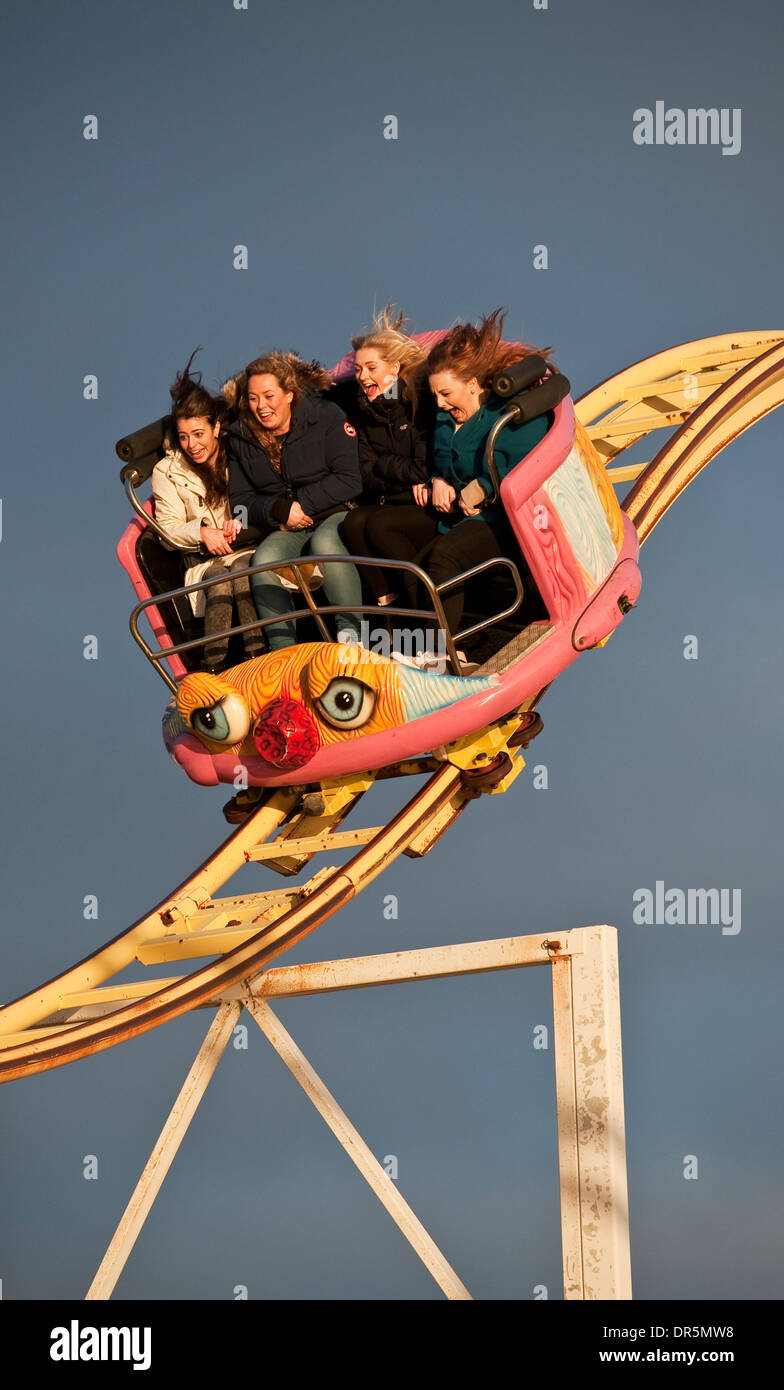 Four girls on the Crazy Mouse rollercoaster ride on Brighton Pier, UK Stock Photo