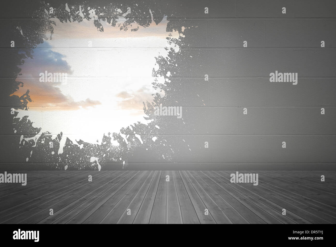 Splash on wall revealing bright sky Stock Photo