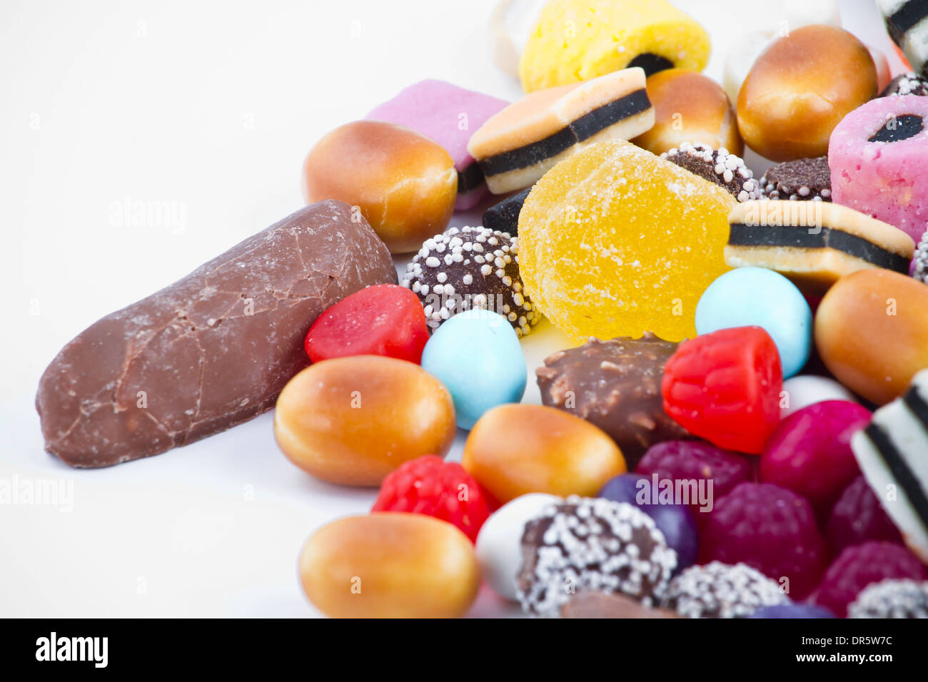 Many candy on white background Stock Photo - Alamy