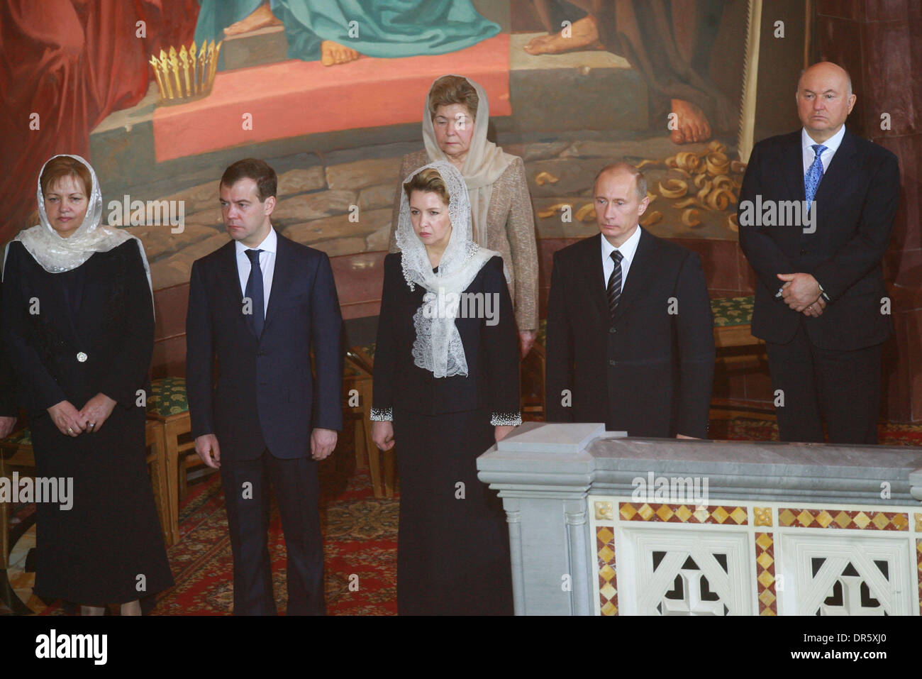 Feb 01, 2009 - Moscow, Russia - L-R Wife of Moldova President TAISIYA VORONINA, President DMITRY MEDVEDEV (C), his wife, SVETLANA MEDVEDEVA and Prime Minister VLADIMIR PUTIN (L) and Boris Yeltsin`s widow NAINA YELTSINA in the background attending the enthronement ceremony of Patriarch Kirill of Moscow and All Russia, the 16th leader of the Russian Orthodox Church, at the Cathedral  Stock Photo