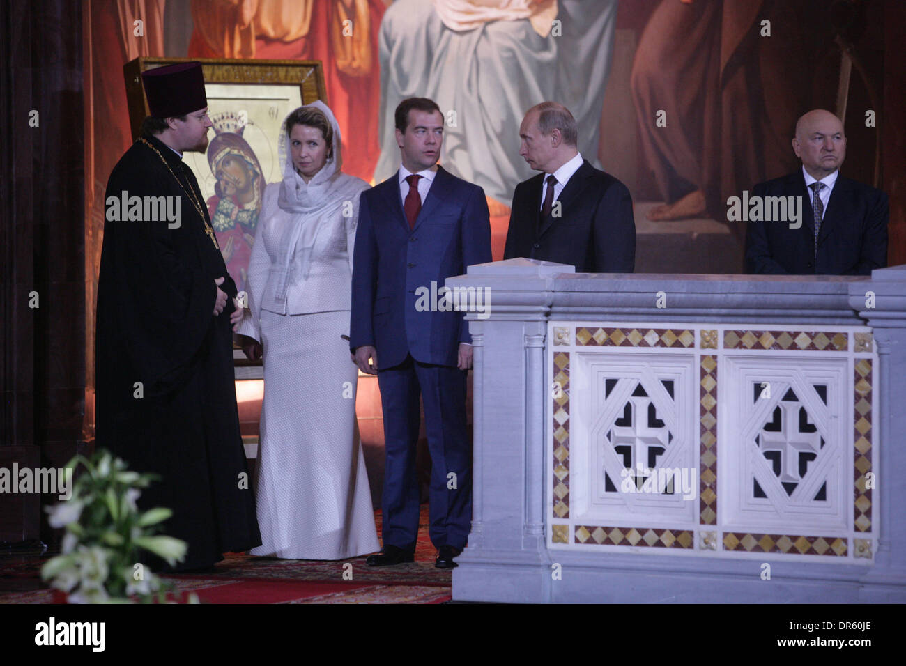 Apr 19, 2009 - Moscow, Russia - Prime Minister of Russia VLADIMIR PUTIN (c) and President DMITRY MEDVEDEV with wife Svetlana (L) get Easter blessing at Orthodox ceremony at the Christ the Savior Cathedral in Moscow (Mayor of Moscow Yuri Luzhkov pictured right corner) (Credit Image: © PhotoXpress/ZUMA Press) Stock Photo