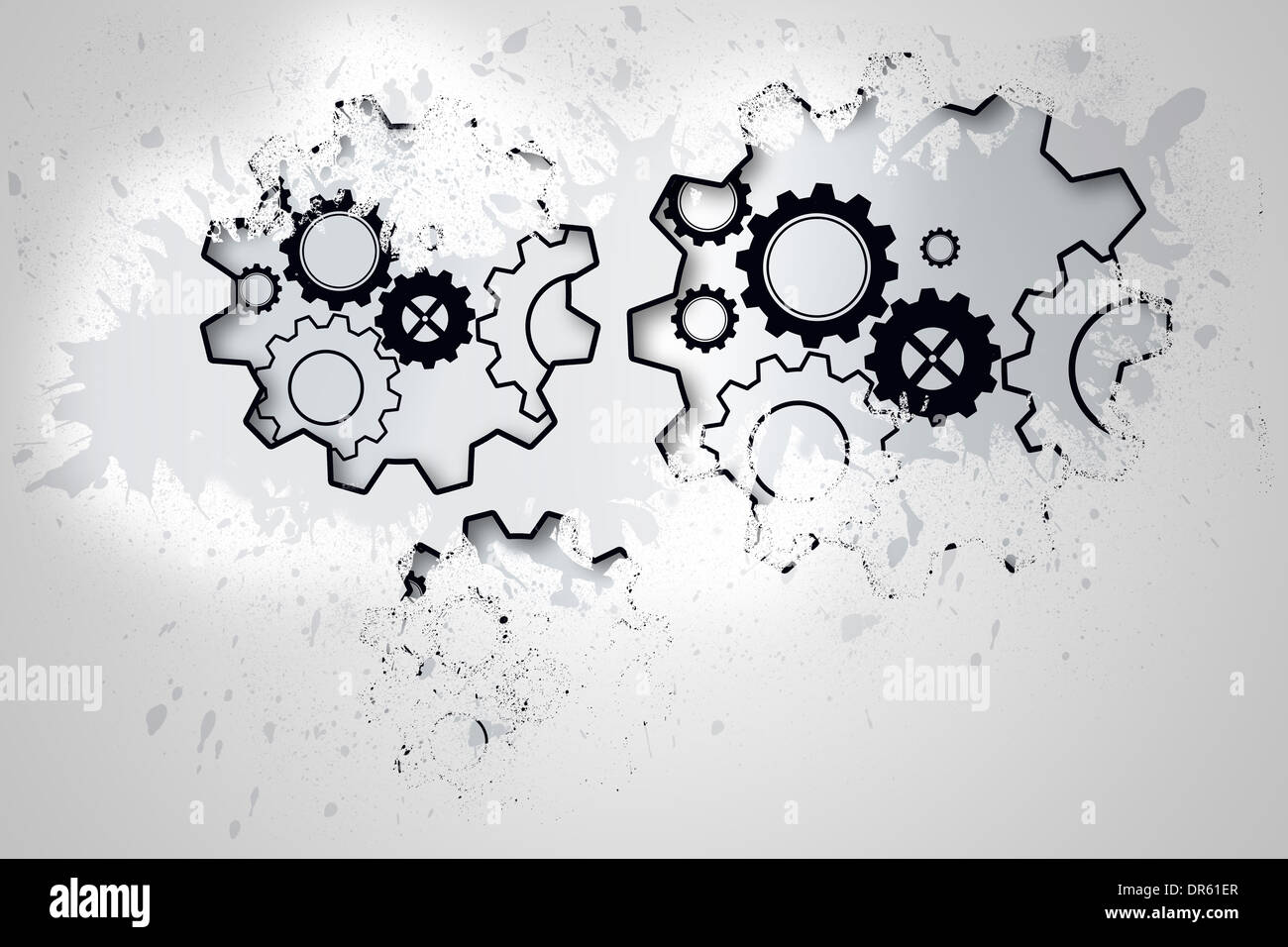 Splash on wall revealing cogs and wheels Stock Photo