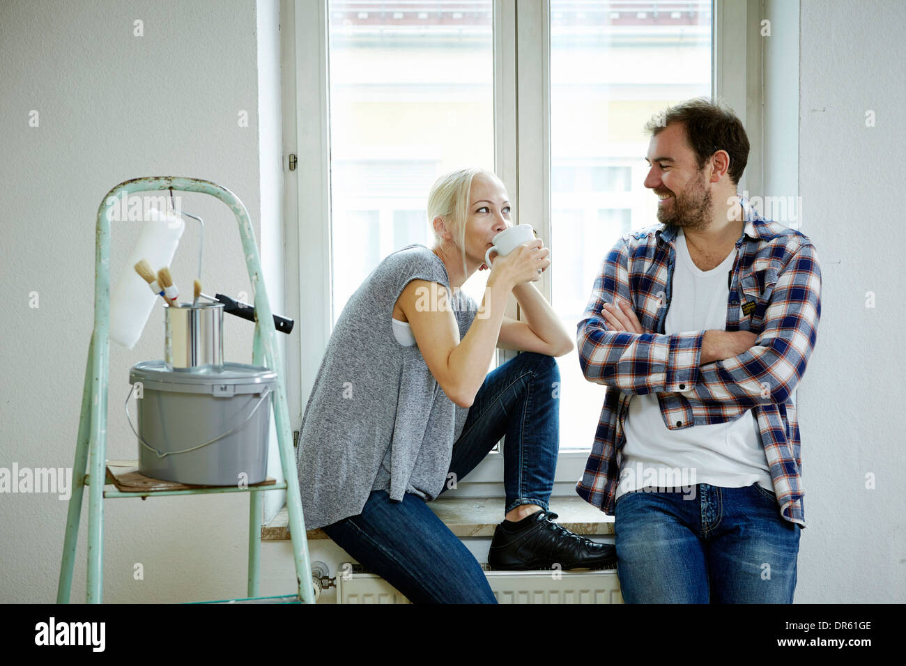 Home improvement, couple  taking a coffee break, Munich, Bavaria, Germany Stock Photo