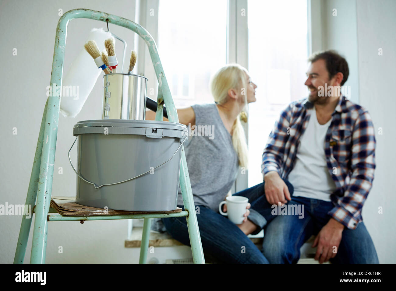 Home improvement, couple  taking a coffee break, Munich, Bavaria, Germany Stock Photo