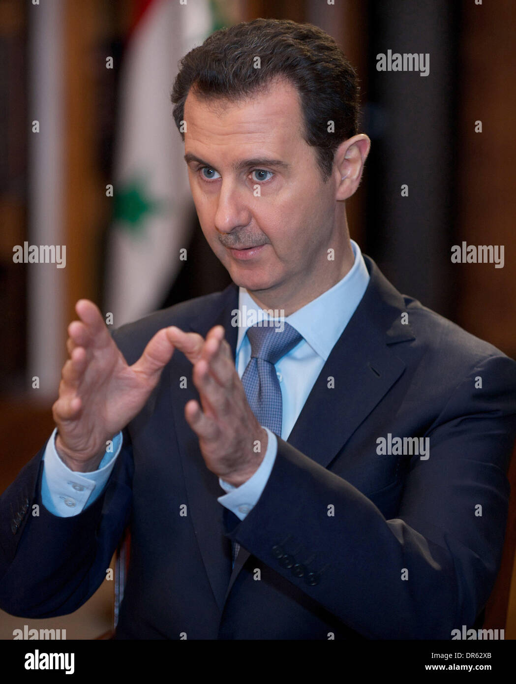 Beijing, Syria. 20th Jan, 2014. Syrian President Bashar al-Assad speaks during an interview with AFP at the presidential palace in Damascus, Syria, Jan. 19, 2014. Credit:  SANA/Xinhua/Alamy Live News Stock Photo