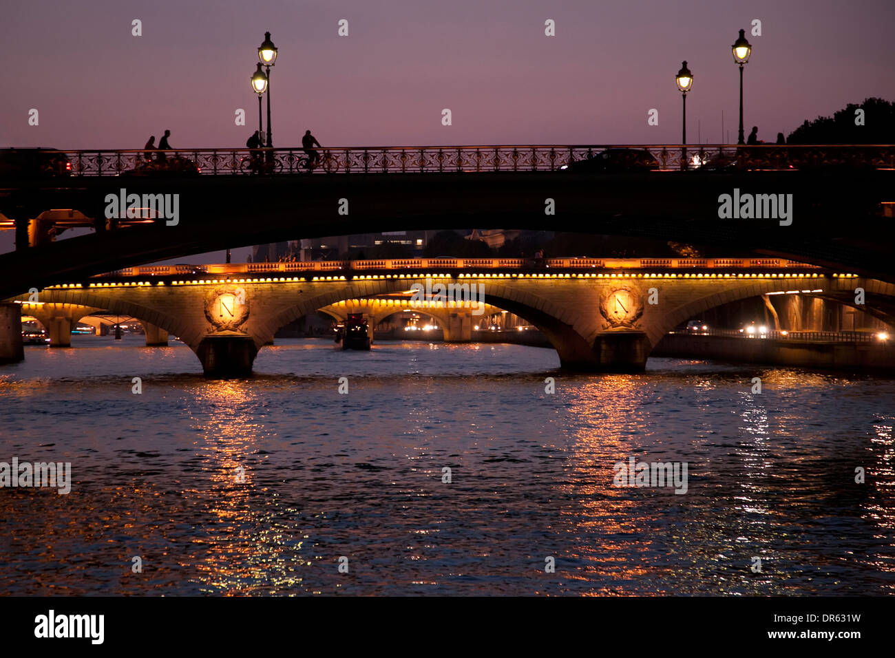 Bridges over the River Seine in Paris at night Stock Photo