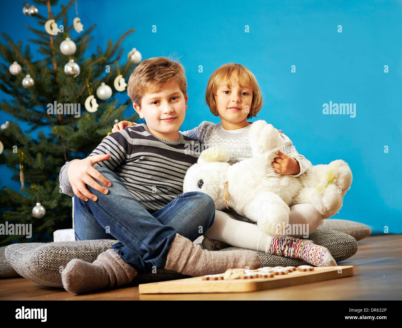 Children playing with stuffed toy on Christmas Eve, Munich, Bavaria