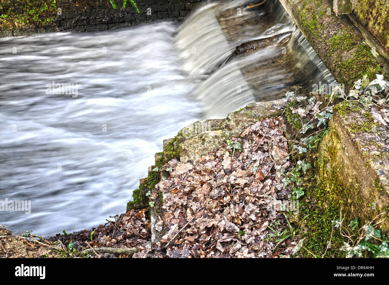 Small but fast flowing waterfall in the countryside near Brighton, England Stock Photo