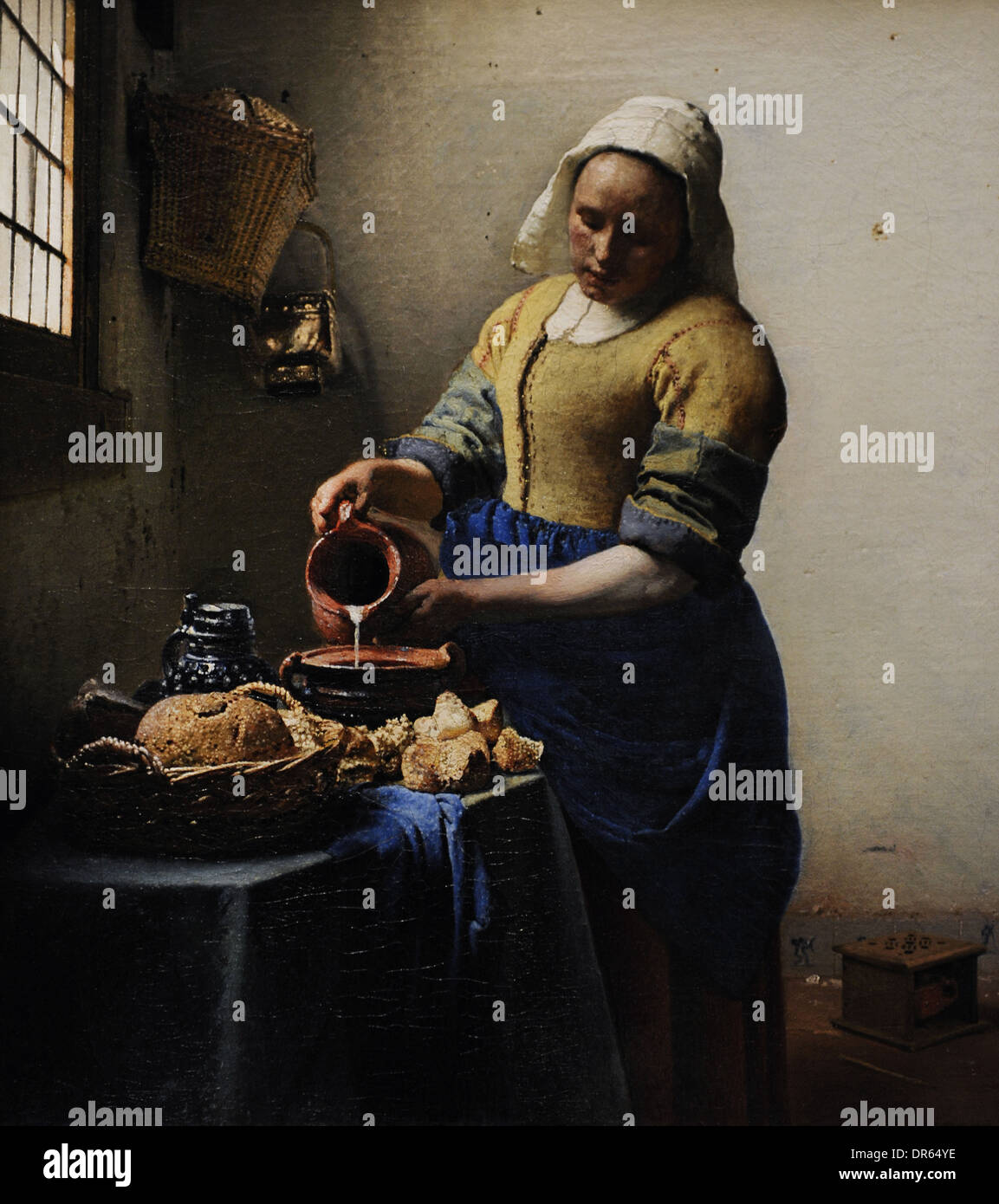 Johannes Vermeer (1632-1675). Dutch painter. The Milkmaid, c, 1660. Rijskmuseum. Amsterdam. Netherlands. Stock Photo