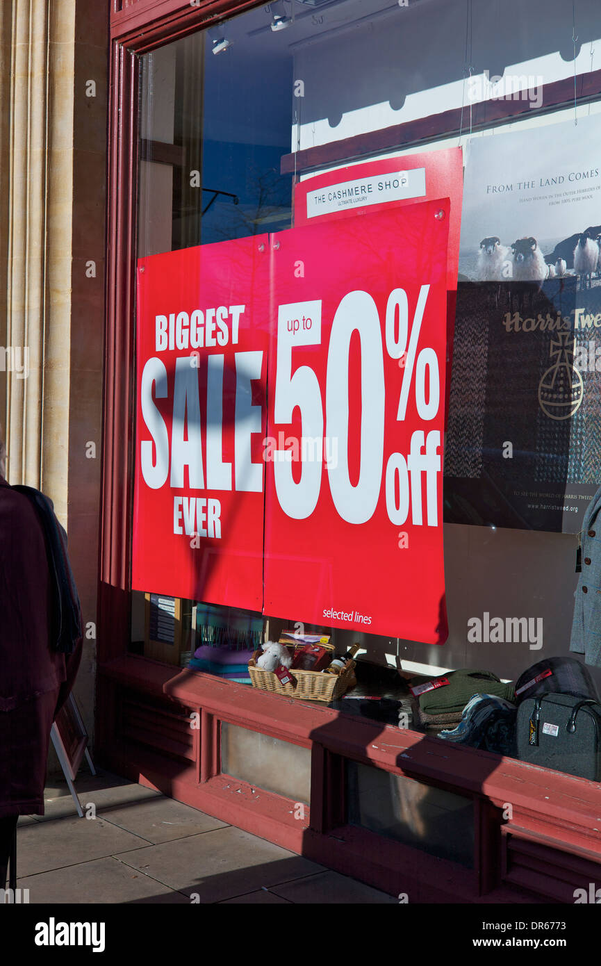 Sale signs in shop window, UK Stock Photo