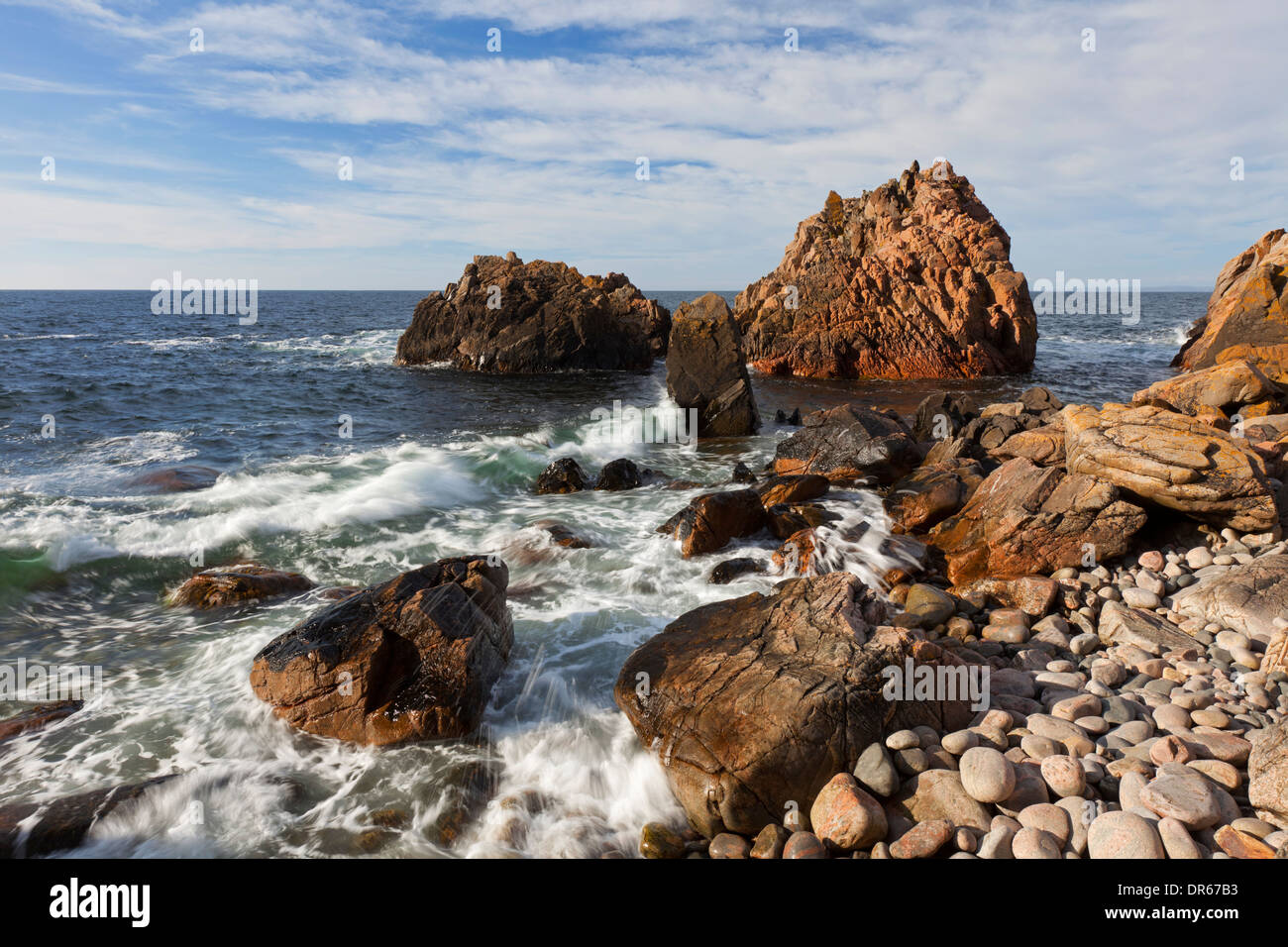 Waves crashing into rocks on the beach cove at Visitgrottan, Kullaberg / Kullen, Skåne, Sweden Stock Photo