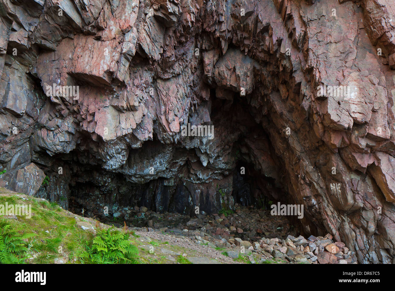 Cave at the bottom of cliff at Visitgrottan, Kullaberg / Kullen, Skåne, Sweden Stock Photo