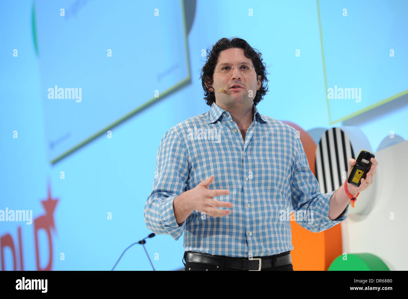 MUNICH/GERMANY - JANUARY 20: Michael Fertik (Reputation.com) gestures on the podium during the Digital Life Design (DLD) Conference at the HVB Forum on January 20, 2014 in Munich, Germany. DLD is a global network on innovation, digitization, science and culture which connects business, creative and social leaders, opinion-formers and influencers for crossover conversation and inspiration. (Photo: picture alliance / Jan Haas) Stock Photo