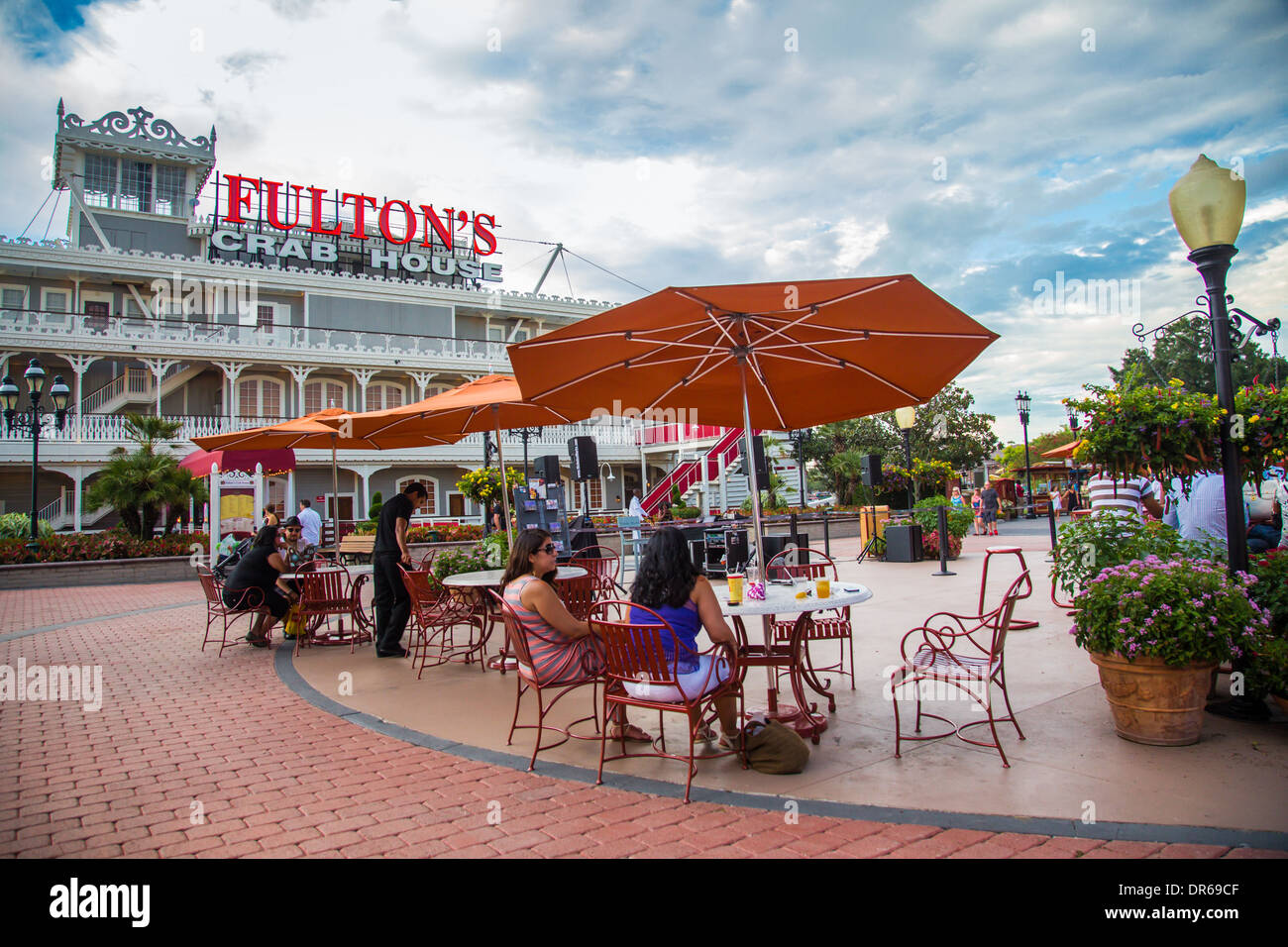 View of Downtown Walt Disney Village in Lake Buena Vista with visitors resting Stock Photo