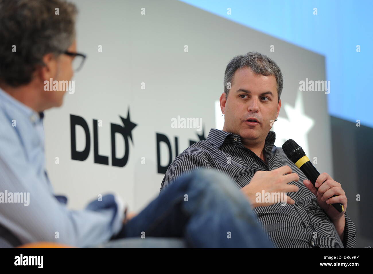 MUNICH/GERMANY - JANUARY 20: Martin Varsavsky (Fon, l.) talks with Cory Ondrejka (Facebook) on the podium during the Digital Life Design (DLD) Conference at the HVB Forum on January 20, 2014 in Munich, Germany. DLD is a global network on innovation, digitization, science and culture which connects business, creative and social leaders, opinion-formers and influencers for crossover conversation and inspiration. (Photo: picture alliance / Jan Haas) Stock Photo