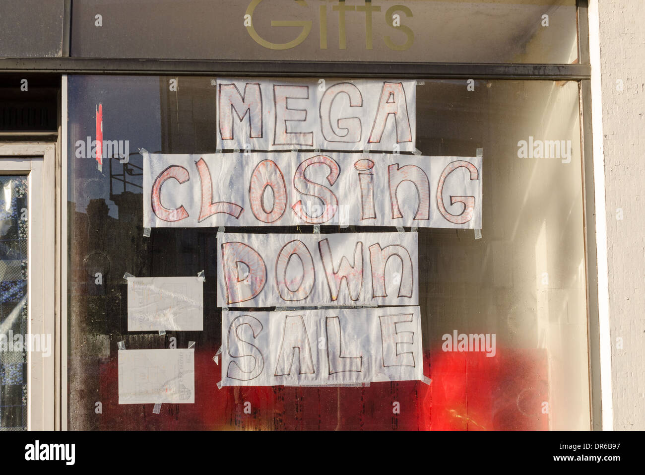 Mega Closing Down Sale hand drawn poster in shop window Stock Photo