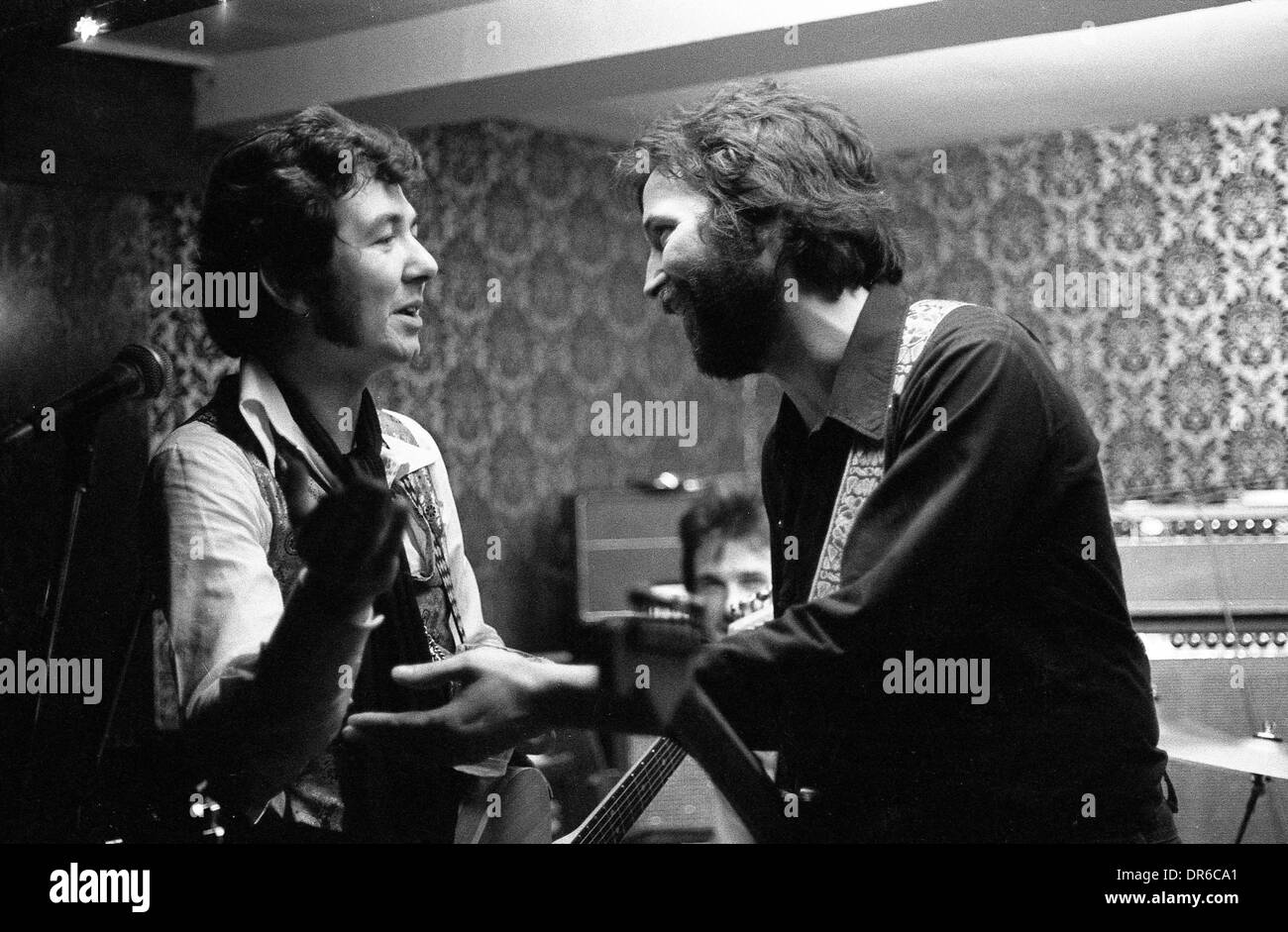 Ronnie Lane performing with Eric Clapton at the Drum and Monkey pub in Minsterley in the 1970's PICTURE BY DAVID BAGNALL Stock Photo