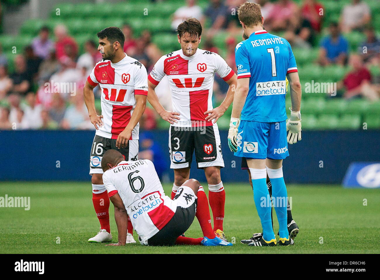 Melbourne, Australia. 17th Jan, 2014. Melbourne Heart players wait for PATRICK GERHARDT of the Melbourne Heart to get up after hurting himself during the round 15 match between Melbourne Heart and Newcastle Jets - Australian Hyundai A-League season 2013/2014 at AAMI Stadium. © Tom Griffiths/ZUMA Wire/ZUMAPRESS.com/Alamy Live News Stock Photo
